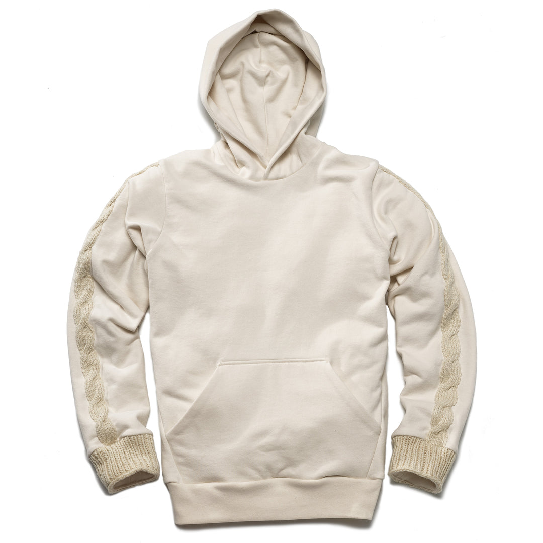 White hoodie with kangaroo pocket and hand knit wool cuffs and cable knit motif on sleeve