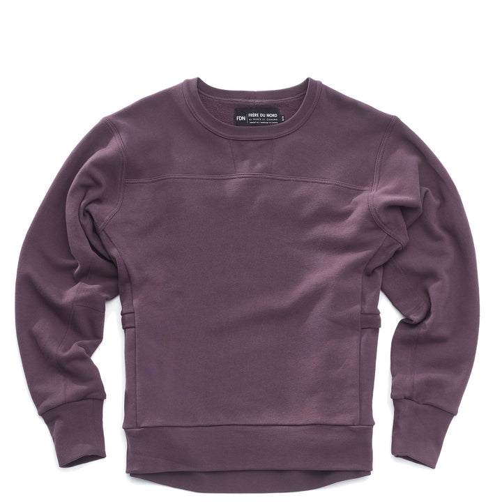 A purple crewneck sweatshirt with long sleeves, featuring a crew neck design, side panel pockets and made of a solid color fabric.