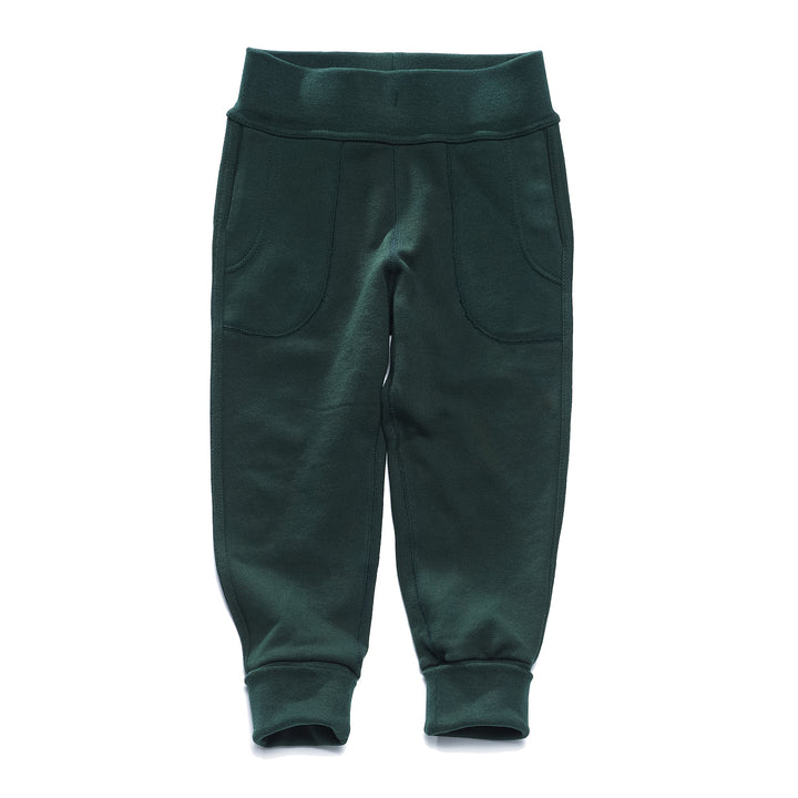 A pair of green children's pants with flatlocked seams, top stitched waistband, and  grow with me cuffs rolled up slightly.