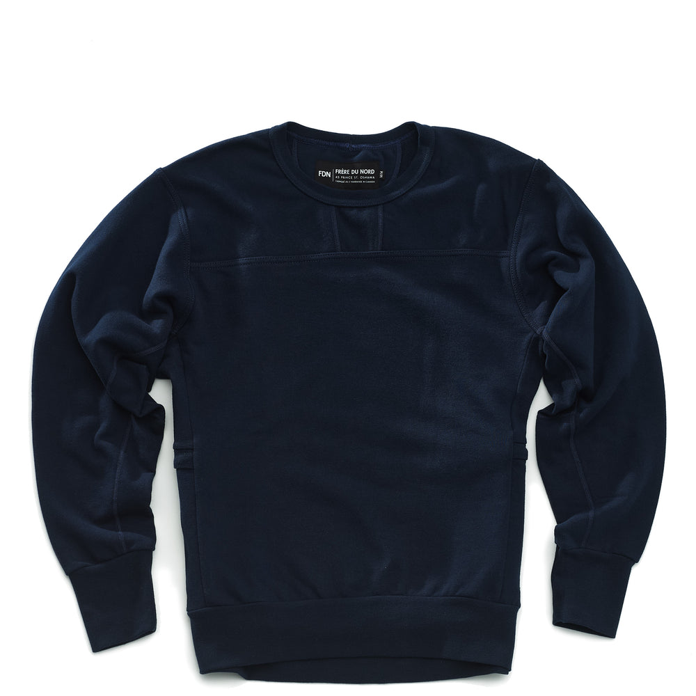 A navy crewneck sweatshirt with long sleeves, featuring a crew neck design, side panel pockets and made of a solid color fabric.