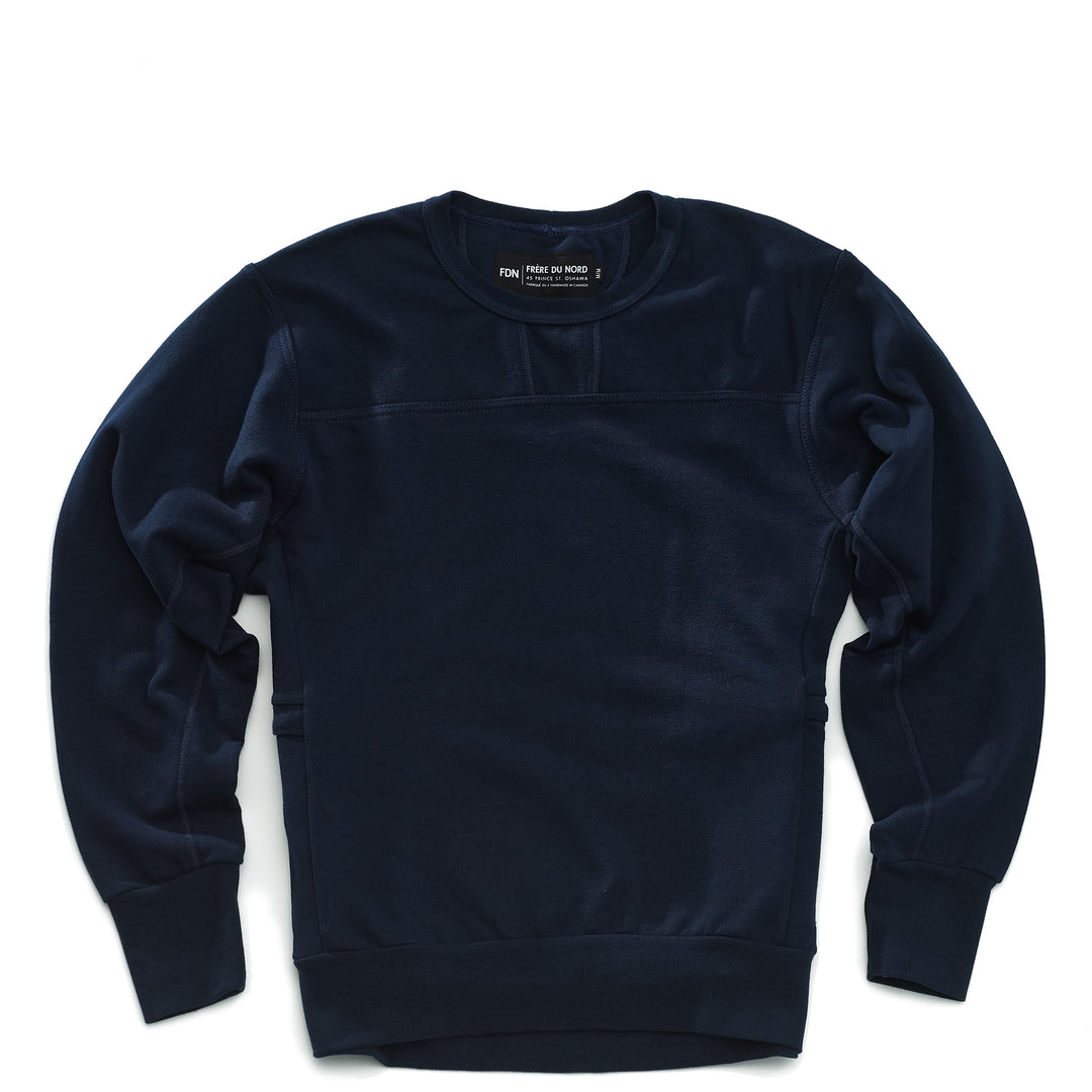 A navy crewneck sweatshirt with long sleeves, featuring a crew neck design, side panel pockets and made of a solid color fabric.