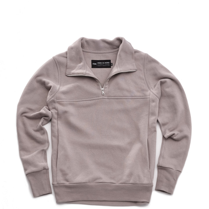 Grey pullover sweater with a quarter zip silver zipper on a white background