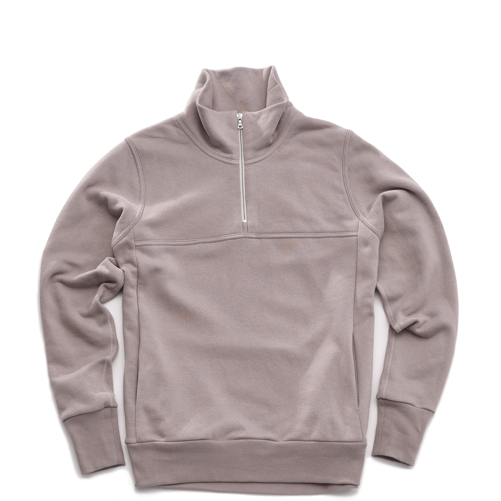 Grey pullover sweater with a quarter zip silver zipper on a white background