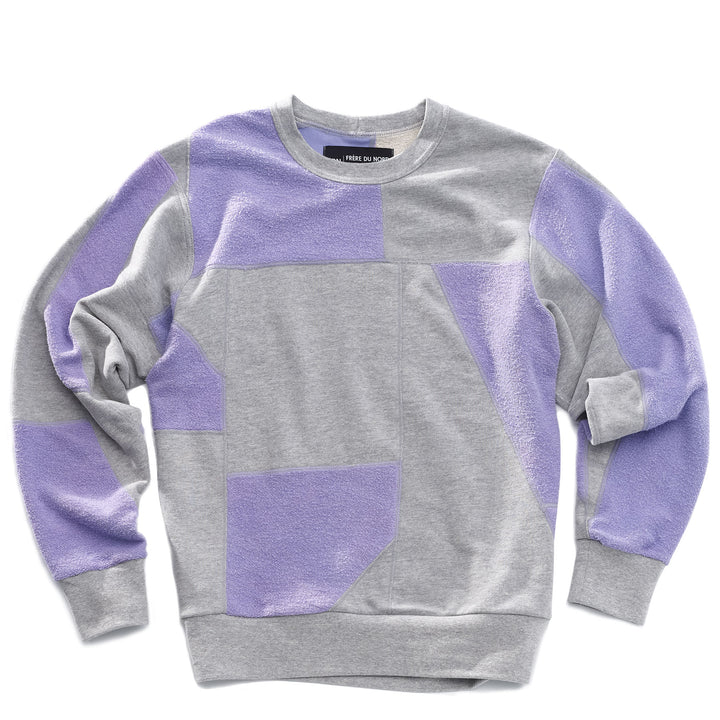 An upcycled crewneck sweater with heather grey and lavender pieces combined to make a unique geometric pattern.