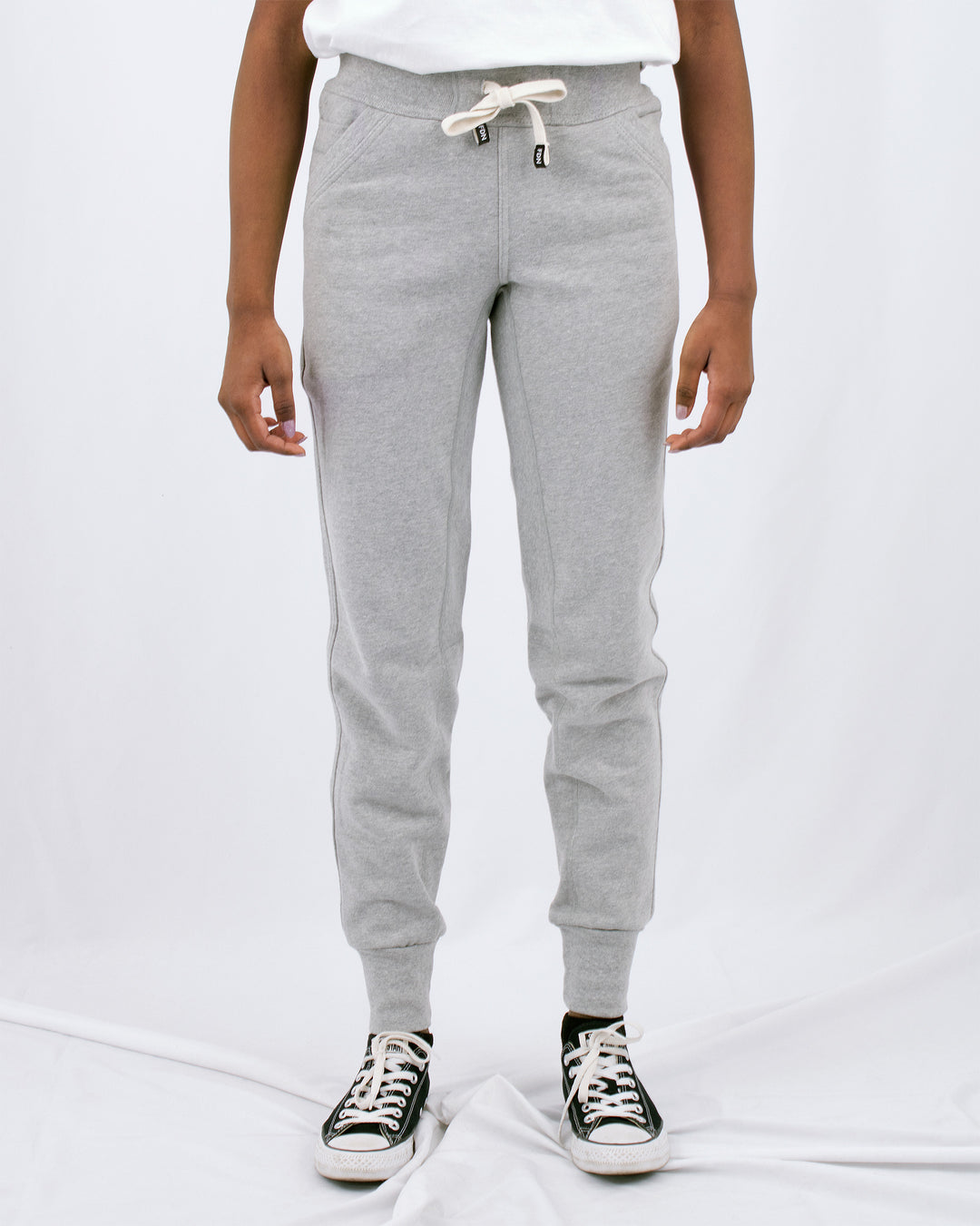 Sustainable Mens Womens Warm loungewear Sweat Pants Comfortable Luxury Light Grey Sueded Napped Soft French Felted Cotton Terry Fabriqué au Canada. High Waisted with slim tailoring in the leg. Angled front pockets with interior cellphone pockets and inner leg rib gusset. Cotton Drawcord FDN clothing made in canada