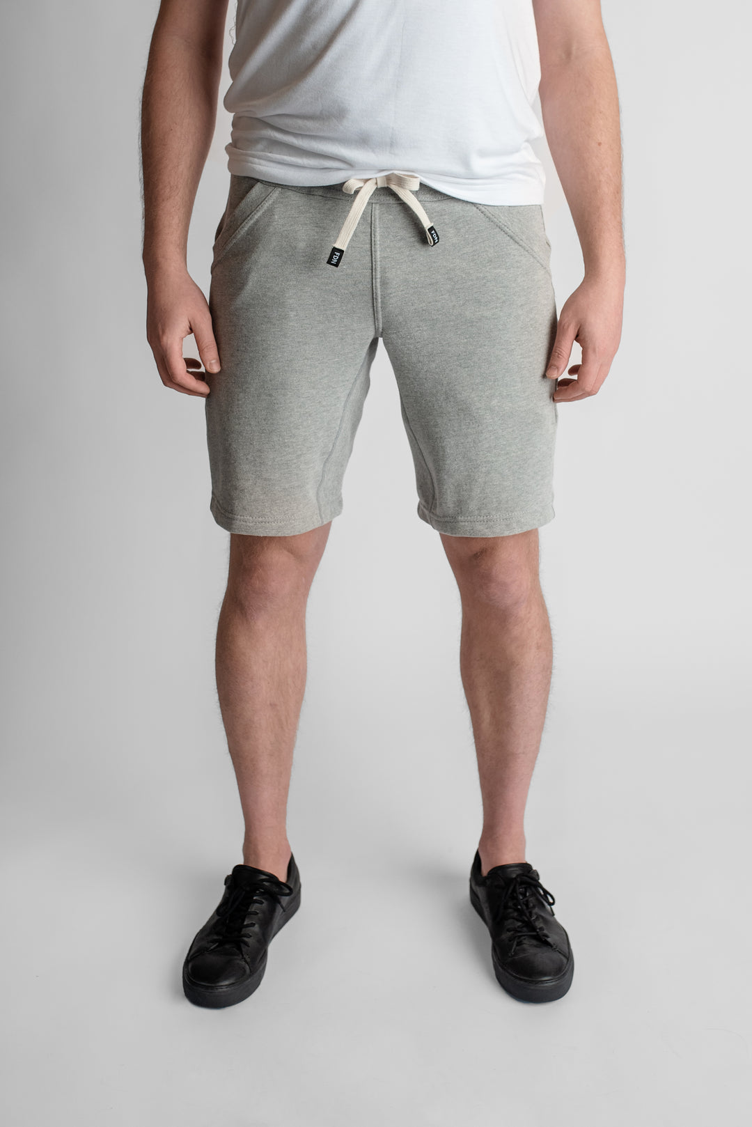 Light Grey Sweat Shorts Sustainable Mens Womens Comfortable Luxury Sueded Napped Soft French Felted Cotton Terry Fabriqué au Canada. Angled front pockets with side cellphone pockets and inner leg rib gusset. Cotton Drawcord clothing made in canada